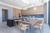 Kitchen, Marble Backsplashe, White Cabinet, Marble Counter, Pendant Lighting, Wall Oven, and Ceiling Lighting Main kitchen  Photo 13 of 27 in The Estate Penthouse by Tatum Brache