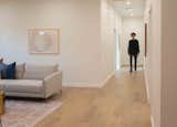 The new hallway/entryway acts as a light well connecting the addition to the original communal areas.
