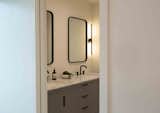 The primary bathroom has a cozy and private feel.