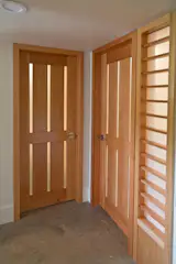 Custom fir doors with frosted glass allows light to penetrate the unit.