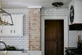 Exposed Brick and Subway Tile to the Ceiling