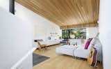 The sloped living room ceiling creates an intimate compression at the low end - a delightful spot to read within the tree tops, or enjoy snow falling on the street below.