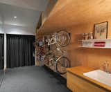 The owners are avid cyclists, generally coming and going by bicycle. A second entrance provides direct access to a lower level with spacious bicycle storage, wash area, and plenty of closet space.