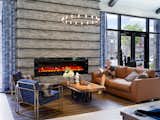 The soaring double-height ceiling gives the lounge an open and airy feel, punctuated by cozier spaces throughout.