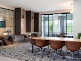 A conference room includes co-working spaces that make it convenient and comfortable to work from home.