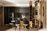 Dining area and kitchen, featuring brass and mirrored divider, by Trilbey Gordon, Interior Designer