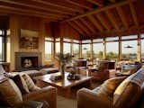 Living Room, Pendant Lighting, Standard Layout Fireplace, Wood Burning Fireplace, Sofa, Ottomans, Chair, and Coffee Tables  Photo 7 of 10 in Roosevelt Ranch by Walker Warner