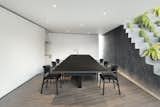 The custom-built dining table can flip up to accommodate additional seating. 