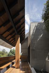 Aperture House by Formwerkz Architects courtyard, tropical architecture, timber seating, terrace, concrete architecture 
