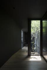 A courtyard rises up through three stories of the house. 