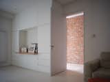 Simple white joinery in the common study area provides a coherent and tranquil atmosphere. 
