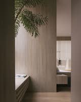 A Trufa wall lamp from David Pompa hangs at the bedside of the master bedroom. 