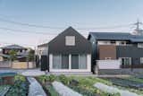 Exterior, A-Frame RoofLine, Metal Siding Material, Shingles Roof Material, and House Building Type The rudimentary form of the house mimics the pitched-roofed building surrounding the plot.   Photo 2 of 15 in In Japan, a Straight-Ahead Gable Home Takes an Unexpected Turn