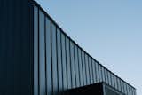 The curve in the plan becomes a motif  extended to the vertical surface. 