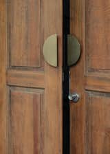 "We scraped off parts of the painted façade to reveal the original timber of the main doors and windows,