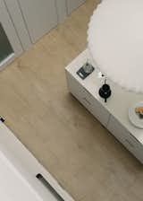 After: Timber flooring in the kitchen adds to the Scandinavian aesthetic that Kelvin and Shuwen like, matched with white cabinetry from String®.