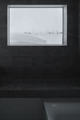 The owner appreciates the vantage. “The bathroom has a window to the south. It gives the feeling of an open-air bath with a view of sky and fields. When I look at the mirror, the view is reflected in it.”   