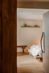Teak doors with a teak handle divide the common and private zones. 