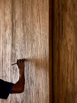 The patterns of the antique teak door panels were drawn over to emphasise their grains.