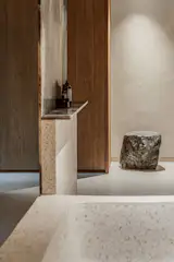 The master bathroom features terrazzo and marble. 