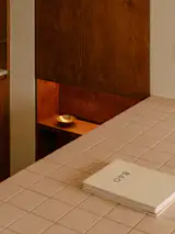 The unique mixture of solid birch plywood and tiles enlivens the small home. 