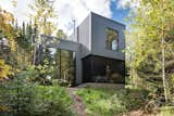 Large windows and a large screen porch make indoor/outdoor living a reality for this tiny 900sf cabin. Low maintenance corrugated metal siding means more time enjoying the surroundings and less time maintaining the cabin.