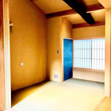A beam salvaged from an old house lends gravitas to the studio unit on the second floor. The tatami bedroom can be closed off from the kitchen and dining area with a sliding fusuma door that is usually kept open during the day. 