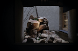 The central garden as seen from the ground floor corridor. According to garden designer Aki Murase, who tries to find a place for materials passed over by others, these rocks would not normally be used in a Japanese garden as they would be considered too rough and ugly. 