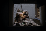 Outdoor, Boulders, Garden, and Trees The central garden as seen from the ground floor corridor. According to garden designer Aki Murase, who tries to find a place for materials passed over by others, these rocks would not normally be used in a Japanese garden as they would be considered too rough and ugly.   Photo 4 of 8 in Komatsu South by Yi Hsen Gian