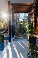 Private corner lot sits high on a hill and overlooks a wooded ravine across the street. 