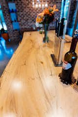 The kitchen island top is made from local spalted Beech with boards that are a book-matched grain with a live edge and finished with a zero VOC finish for food safety.