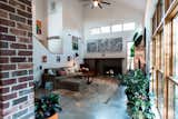 Exposed brick and wood windows create texture.