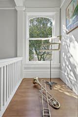 A corner tower bay window fills the room with natural light.
