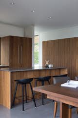 Kitchen, Quartzite Counter, Refrigerator, Concrete Floor, Recessed Lighting, and Wood Cabinet View of Kitchen  Photo 13 of 17 in Meyers Residence by W  O  V  E  N   Architecture and Design