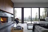 Living Room, Concrete Floor, Chair, Sofa, and Wood Burning Fireplace View from Living Room  Photo 16 of 17 in Meyers Residence by W  O  V  E  N   Architecture and Design