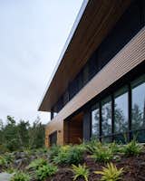 Exterior, Flat RoofLine, Metal Roof Material, Glass Siding Material, House Building Type, and Wood Siding Material View at Entry facade  Photo 2 of 10 in Vertes Retreat by W  O  V  E  N   Architecture and Design