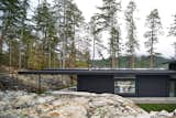 Exterior, House Building Type, Wood Siding Material, Glass Siding Material, Metal Roof Material, and Flat RoofLine View from behind  Photo 6 of 10 in Vertes Retreat by W  O  V  E  N   Architecture and Design