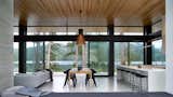 Dining Room, Chair, Ceiling Lighting, Table, and Concrete Floor View at Dining  Photo 7 of 10 in Vertes Retreat by W  O  V  E  N   Architecture and Design