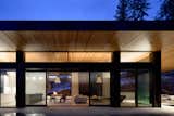 Exterior, House Building Type, Metal Roof Material, Wood Siding Material, Flat RoofLine, and Glass Siding Material View into Great Room  Photo 10 of 10 in Vertes Retreat by W  O  V  E  N   Architecture and Design