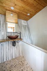 Hügge Home - the angled wall provides an ergonomic angle to the bath