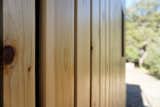 The open jointed cedar siding allows air to flow through, reducing the heat exposure on the building