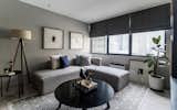 This modern yet cozy living room highlights the home owner's artworks on the wall. 