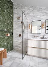 Large scale mid-century modern clay tiles make the best use of a 14-foot walk-in shower wall.