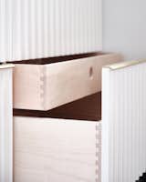 Hand-molded brass hardware and dovetail drawer compartments designed to house storage compartments for all of our storage needs.