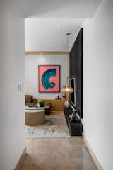 Entrance - The custom artwork by Cristian armenta is framed by white walls in the entrance to the apartment. 