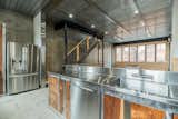 Custom stainless steel & black walnut kitchen, galvanized steel ceiling, custom LED lighting, Low-E Glass Casement Window Wall