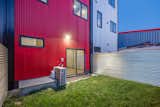Corrugated Galvalume-coated steel siding and galvanized steel fencing  (facing south)