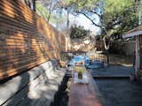 Before: The back deck had a long integrated bench that wasn't very conducive or comfortable for social gatherings.