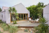Pink House by And And And Studio garden and deck