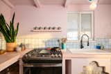 The color pink is also integrated into the kitchen countertops.